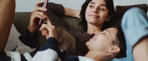 two women looking at phone